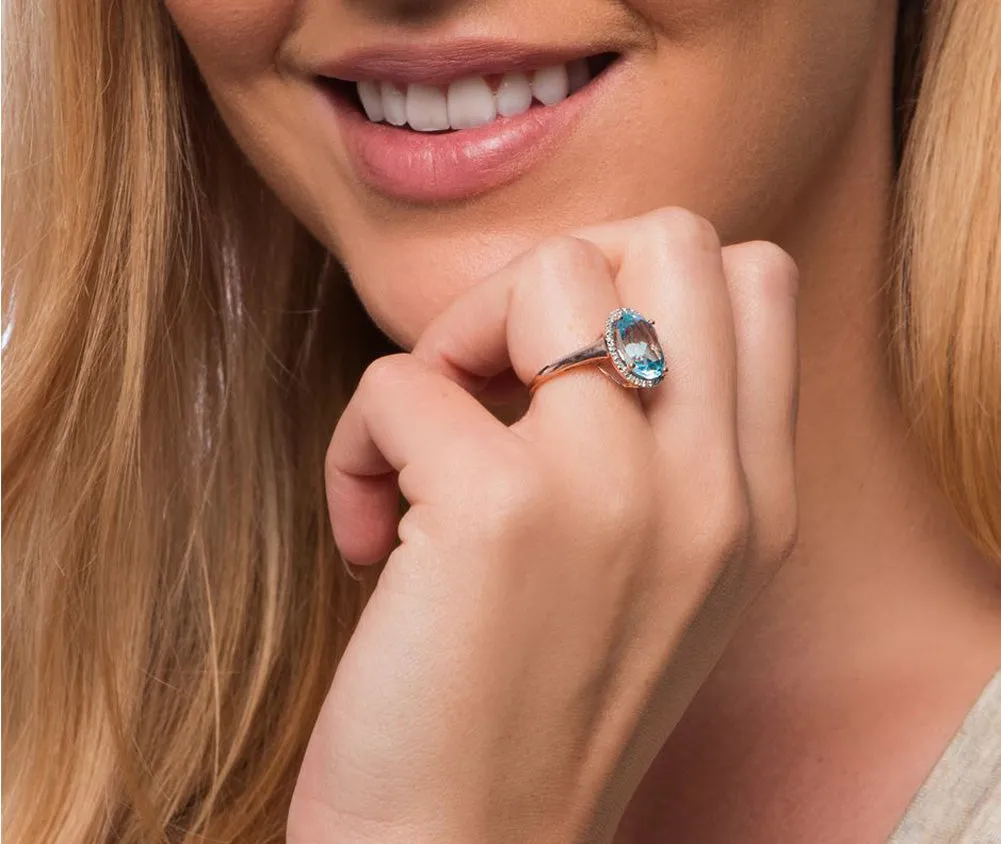 10k White Gold 3.80ct Oval Blue Topaz and Diamond Halo Ring