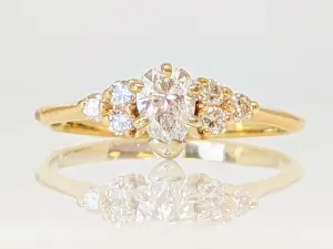 14K .50 CARAT TOTAL WEIGHT SI2 G DIAMOND PEAR WITH (6) ROUND ESTATE RING 2.0 GRAMS