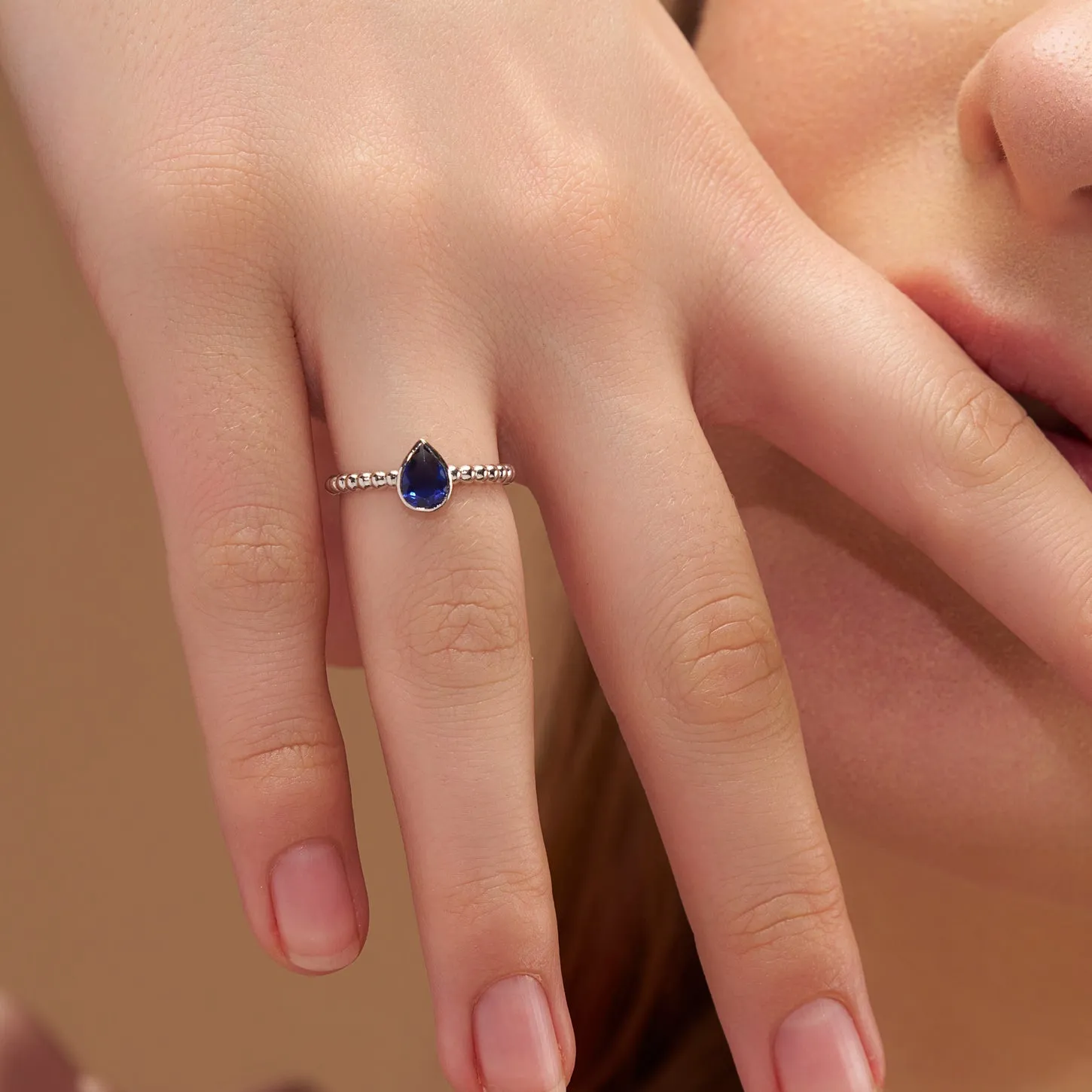 Elegant Blue Pear Solitaire Ring